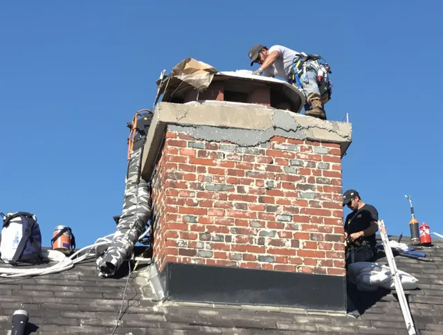 St. Simons Chimney Sweep installing a custom chimney crown in St. Simons, GA