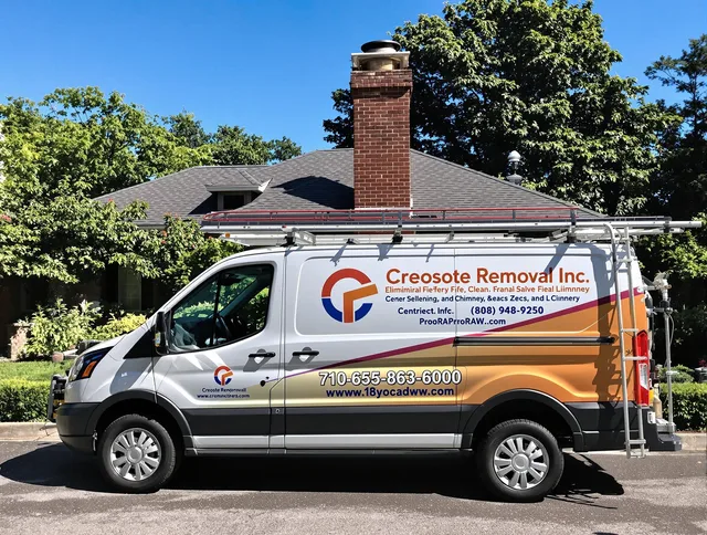 St. Simons Chimney Sweep technician removing creosote safely in St. Simons, GA